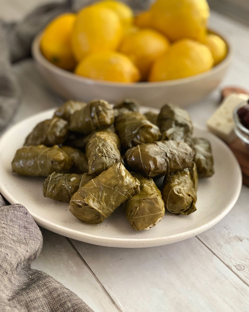 a plate of stuffed grape leaves 