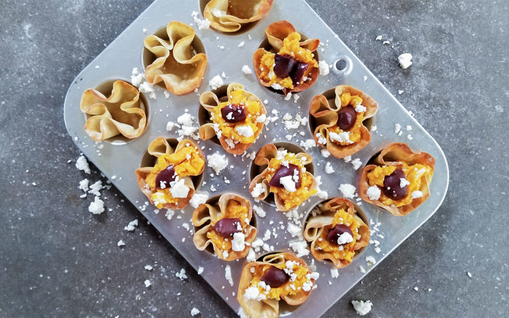 Sweet Potato Feta Wonton Cups in a muffin tin