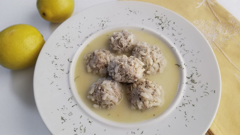 Youvarlakia (Greek Meatball Soup) in a bowl