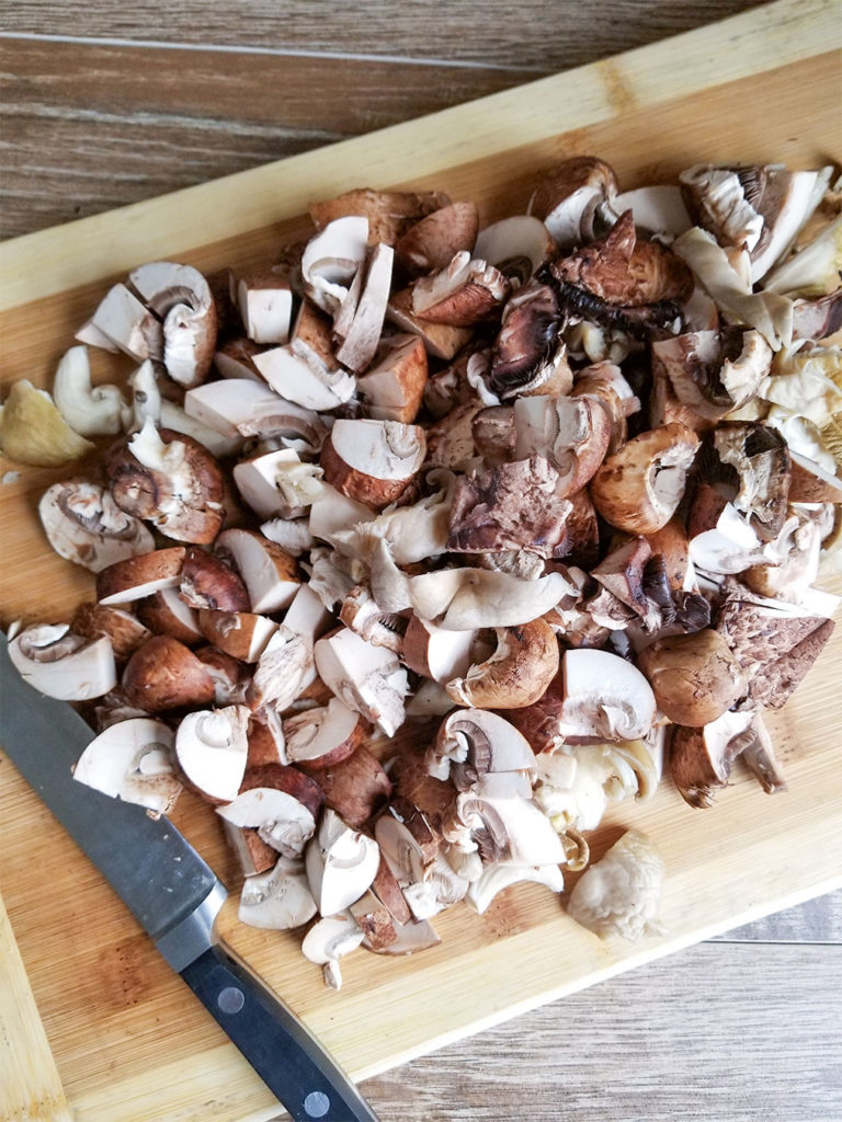 chopped mushrooms on a cutting board